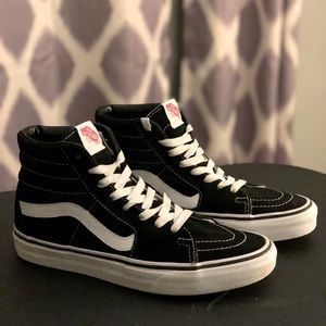 Black and white high top Vans